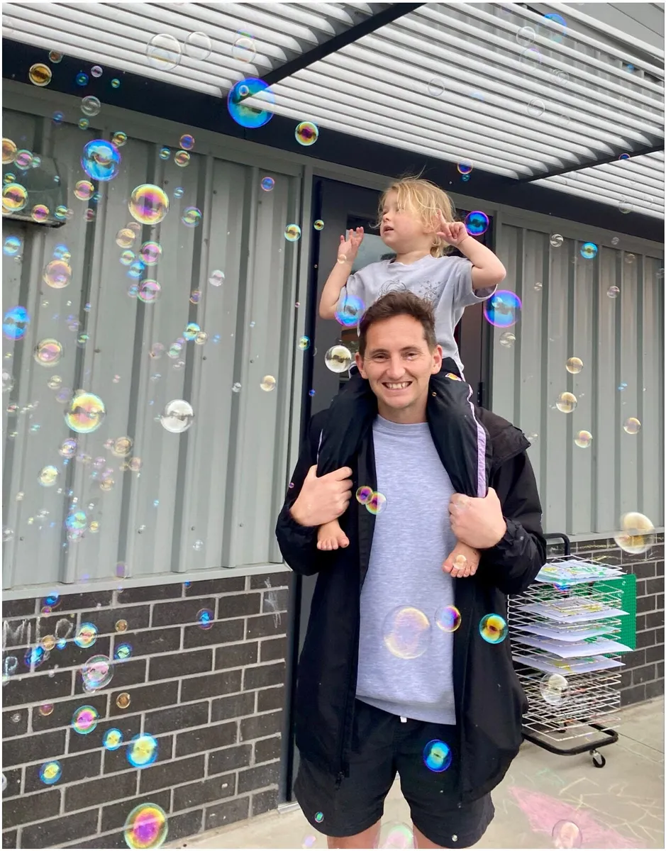 Indi on Orrin’s shoulders at a Father’s Day bubble party